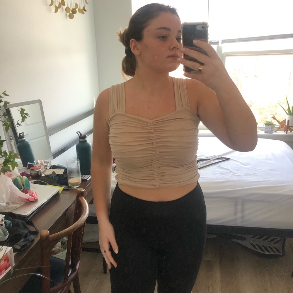 cropped tan top.